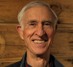 Smiling man facing camera indoors